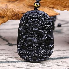 Chinese Dragon Obsidian Necklace - Courage and Endurance Black Spiritual Jewelry With Dragon Design, Spiritual Black Jewelry With Dragon Design, Black Dragon Design Jewelry Gift, Black Jewelry With Dragon Design For Gift, Black Carved Jewelry Gift, Black Amulet Style Pendant, Black Amulet Pendant Jewelry, Black Carved Spiritual Necklace, Traditional Black Onyx Necklace