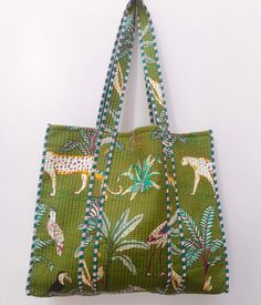 "Cotton quilted Jhola Bag made by Indian Artisans, this cotton quilted shopping bag is totally unique and multi purpose. Use this for your grocery or as a travel bag. Perfect to suit all. The Indian Hand Block Printed Cotton Quilted Women's Handbags from Rajasthan India. This Handbag is completely Indian Printed on good quality cotton. Material:  Cotton Fabric Color - Green Pattern: Floral  Style: Tote Bag, Handle Bag, Shoulder Bag Size in Inch:- Height-18\" inch Width- 19\" inch Handle-13\" inch Product Work: Printed & quilted Stitched Usage : Cosmetic, Make-up, Travel, Toiletries, Medicine, Accessories, Shopping and much more. Perfect for Beach Visits/ Quick Grocery runs/ Carrying Kids items/ Artist Paint book and Paints /Extra Bag Washable on Cold / Delicate wash Make a good Sustainable Everyday Green Quilted Bag, Square Green Quilted Bag, Green Quilted Square Bag, Green Quilted Bag For Daily Use, Green Quilted Rectangular Bag, Green Quilted Shopping Bag, Green Reversible Rectangular Bag, Green Quilted Tote Shoulder Bag, Rectangular Cotton Reversible Shoulder Bag