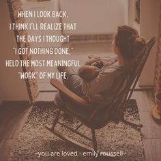 a woman is sitting in a rocking chair with her baby and the words, when i look back, i think i'll realize that