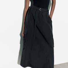 Polyamide Chic Long Cargo Skirt For Spring, Black Cargo Skirt For Spring, Black Maxi Skirt For Workwear In Summer, Black Maxi Skirt For Summer Workwear, Black Cargo Skirt For Spring Workwear, Spring Black Cargo Skirt With Pockets, Summer Black Lined Cargo Skirt, Versatile Black Asymmetrical Skirt, Black Lined Cargo Skirt