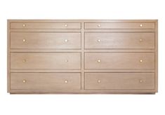 a wooden dresser with many drawers and knobs on the bottom drawer, against a white background