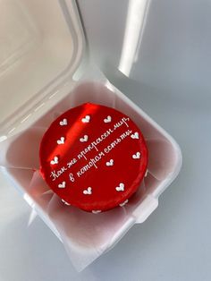 a red cake with white hearts on it in a plastic container that says, you're the perfect cupcake for someone special occasion