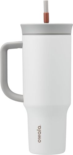 a white coffee cup with a straw sticking out of it's top and lid