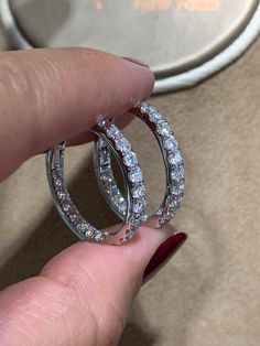 These diamond hoop earrings have been given a stylish touch with elegant round cut diamonds placed inside and out. 18Kt white gold hoop earrings are set with 2.48carats in round diamonds. Every woman can always use a pair of classic diamond hoop earrings to add to their wardrobe. Accessorize with these hoop earrings for fun and casual looks, or formal occasions where you want focus to be on your outfit.Metal: 18KT White GoldDiamond Weight: 2.48ct t.w.Diamond Shape: 38 RoundEarring Width: 3 mmEar White Gold Hoop Earrings, White Gold Hoops, Diamond Hoop Earrings, Diamond Shape, Gold Hoop, Gold Hoop Earrings, Round Cut Diamond, 18k Rose Gold, Every Woman