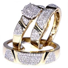 two gold wedding rings with diamonds on them