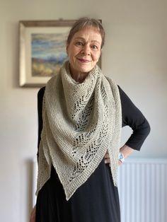 This is a hand knitted triangle shape shoulder shawl with an intricate lace pattern decorating one half of the triangle whereas the second half is left plain. The design gives the shawl an elegant avant garde style appeal. I have used a British sourced, blended and milled pure wool in a natural undyed colour for the shawl. The yarn is a blend of British Jacob and Suffolk sheep breeds and has a rustic feel to it.  The shawl is slightly oversized, warm, and has incredible drape. The fabric is wool Knitted Triangle, Suffolk Sheep, Shoulder Shawl, Sheep Breeds, Knitted Lace, Lace Shawl, Avant Garde Fashion, Shawl Pattern, Shawl Wrap