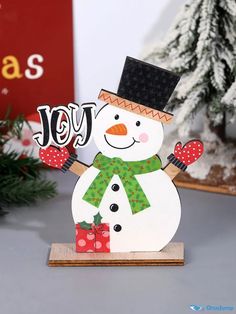 a snowman with a hat and scarf on