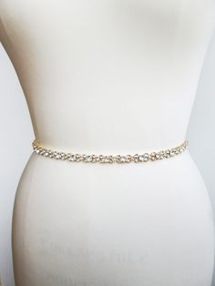 "This sparkly skinny bridal belt is made with Swarovski crystals beaded on 3/8\" wide double face satin ribbon. The crystal part of the belt measures 24\" long and 3/8\" wide. The entire sash measures 150\" long. Available in gold, silver and rose gold finish. This belt can be made with organza, satin or grosgrain ribbon. Shown in the photos in gold finish and with off white satin ribbon. * this belt can be made in any length, please inquire about a different length and pricing" Bridal Sash Belt, Wedding Belt, Wedding Sash Belt, July Wedding, Wedding Sash, Wedding Belts, Swarovski Crystal Beads, Bridal Belt, Crystal Wedding