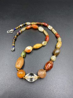 A beautiful collection of rare and genuine very old Agates, Carnelian, Crystal Quartz necklace. The counters are made of glass beads. All the beads are old but the necklace has been newly made with a very attractive design. we provide fast and free shipping service world wide Antique Carnelian Necklaces With Natural Stones, Vintage Carnelian Oval Beaded Necklaces, Antique Carnelian Necklace With Large Beads, Artisan Hand-strung Carnelian Beads, Crystal Quartz Necklace, Vintage Carnelian Round Beads, Carnelian Agate, Carnelian Crystal, Quartz Crystal Necklace