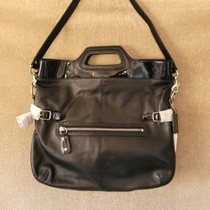 New Vintage Coach "Bonnie" Black Leather Fold-Over Bag. 100% Authentic. Beautiful Soft Leather With Patent Leather Accents. So Many Amazing Things About This Purse In A Classic And Sophisticated Style. The White Tissue Covering Items In Certain Photos Is Still The Original Wraps To Protect Hardware And Leather Details. Features Snap Top Opening, Shoulder Strap That Can Be Removed And Purse Can Be Carried By The Handle As A Satchel (Very Multi-Functional), Silver Hardware, Exterior Zippered Pocke Designer Satchel With Removable Pouch For On-the-go, Leather Shoulder Bag With Silver-tone Hardware For On-the-go, Top Handle Shoulder Bag With Silver-tone Hardware For Shopping, Shopping Shoulder Bag With Top Handle And Silver-tone Hardware, Designer Leather Crossbody Bag, Designer Soft Leather Crossbody Bag, Shopping Satchel With Palladium Hardware And Top Handle, Leather Hobo Bag With Silver-tone Hardware, Leather Hobo Shoulder Bag With Silver-tone Hardware