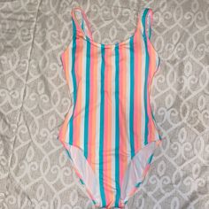 One Piece Swimsuit Condition: Like New / Never Worn Color: Bright / Pink, Blue, Orange, White Size: Small Cute For Sitting By The Pool Or Vacation!!! Smoke Free Home!!! Multicolor Stretch Bodysuit For Beach Party, Stretch Multicolor Bodysuit For Beach Party, Striped Stretch Bodysuit For Beach Season, Stretch Striped Bodysuit For Beach Season, Striped Stretch Bodysuit For Poolside, Striped Stretch Summer Bodysuit, Spring Striped Bodysuit For The Pool, Striped Stretch Bodysuit For Summer, Casual Pink Bodysuit For Swimming