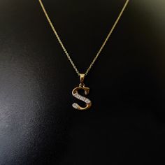 This is an exquisite initial diamond charm pendant set in 14K Solid Gold.  An elegant design, perfect for any occassion ITEM DETAILS: ✓ Letter  : S ✓ Gold Kt: Solid 14K Yellow Gold ✓ 14 K Gold Weight : 1.14 grams ✓ Diamond Shape/ Cut: Round Brilliant ✓ Diamond weight: 0.08 carats  ✓ Diamond No.: 8 Natural Diamonds ✓ Diamond Color: I-J ✓ Diamond Clarity: SI ✓ Gross Weight: 1.16 grams >>The Gold purity is guaranteed and it comes with authentic 14K gold hallmark. >>Jewlery Report provided as well certified by International Gemological Institute (IGI). >>A-Z letters available on my Etsy Shop. CUSTOMER SUPPORT: We are available 24/7 to respond to all your queries! PACKAGING: The pendant comes in layers of safe and secure wrapping along with a free Handmade Jewelry Box. S Pendent Designs, S Pendant Letter Gold, Diamond Initial Pendant Necklace As Gift, Diamond Initial Pendant Necklace For Gift, Gold Diamond Necklace With Initials, Diamond Accents Initial Pendant Necklace As Gift, Initial Pendant Necklace With Diamond Accents For Anniversary, Initial Pendant Diamond Necklace With Accents For Gift, Initials Pendant Diamond Necklace For Formal