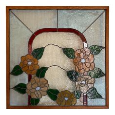 a stained glass window with flowers on it