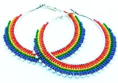 Ready To Ship! Handmade multi-colored earrings will accentuate your look. The base of the earrings is made of steel.  Earrings Size: 2 7/8 " Wide by 2 5/8" Length Please note, that due to monitor settings and lighting differences the actual product may appear slightly different in its colors. These handwoven hoop earrings were made with Miyuki Delica beads in a number of different shades to create this pretty color gradient.  Materials: Delica Glass Seed Beads, Stainless Steel Hoops  I will be glad to answer any questions you may have. Care Instructions: Please do not wear your beaded hoop earrings while swimming, showering, bathing or in the steam bath. Please avoid anything to do with high humidity.  The jewelry pieces are beaded with Nymo Jewelry Thread and humidity will have a negative Multicolor Small Hoop Metal Earrings, Nickel Free Multicolor Metal Hoop Earrings, Nickel-free Multicolor Metal Hoop Earrings, Multicolor Metal Hoop Earrings For Pierced Ears, Multicolor Metal Hoop Earrings, Multicolor Metal Hoop Earrings With Ear Wire, Handmade Multicolor Metal Hoop Earrings, Multicolor Metal Dangle Hoop Earrings, Multicolor Metal Hoop Jewelry