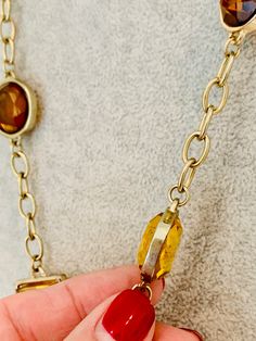 "Vintage Banana Republic long gold tone necklace with amber and yellow colored glass. Signed on the clasp. 29\" long." Glass Necklaces With Gold Chain For Gift, Gold Glass Necklace With Adjustable Chain, Formal Yellow Metal Jewelry, Elegant Orange Necklace With Lobster Clasp, Party Jewelry With Glass And Gold Chain, Party Jewelry With Gold Chain And Glass, Gold-tone Long Necklace For Formal Occasions, Party Gold Chain Glass Jewelry, Adjustable Glass Necklaces For Formal Occasions