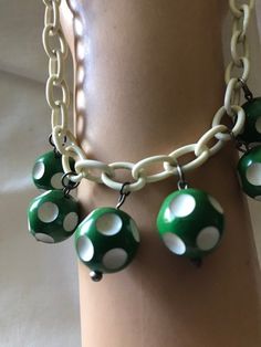 "Very cute fun costume jewelry from the 1940's-50's. Plastic chain link could be celluloid or maybe Bakelite. Little green and white dotted balls are possible the same. Playful costume jewelry from the 1940's. Measurements are; From end to end 17\" Feel free to convo me with any further questions. Thank you for your interest." 1950s Casual Jewelry, Cheap Retro Plastic Jewelry, Vintage Plastic Jewelry For Gifts, Retro Lucite Jewelry As Gift, Retro Lucite Jewelry Gift, Retro Lucite Jewelry Perfect As A Gift, Adjustable Retro Jewelry, Handmade Retro Green Jewelry, Retro Handmade Plastic Jewelry