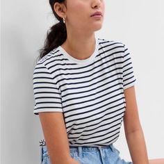 White And Navy Blue Striped T Shirt, Never Worn. Condition Like New. Trendy Everyday Gap Tops, White Relaxed Fit T-shirt By Gap, White Cotton Gap T-shirt, Trendy White Gap Tops, White Trendy Gap Tops, White Cotton Gap Top, Striped Cotton Gap Tops, Gap Striped Cotton Tops, Gap White Short Sleeve Top