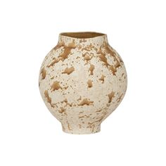 a white and brown vase with speckles on the outside, against a white background