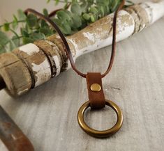 ~Leather O Ring Necklace~ This simple, yet beautiful 1" Antique Brass O 'Ring on a 30" adjustable Brown Leather Cord,  will quickly become your favorite piece of jewelry.  This minimalist necklace is ideal for everyday wear. Wear it on it's own for a minimalist look, or  pair it with several other jewelry pieces for a trendy layered look. This is a great gift for women or teens. Just pull on the knotted ends of the leather cord for your perfect fit.  Ring Finish Options: 《SHIPPING》 🗝Orders will Adjustable Leather Strap Jewelry With Waxed Cord, Leather Jewelry With Adjustable Cord For Everyday Use, Adjustable Leather Cord Jewelry For Everyday Use, Everyday Leather Jewelry With Adjustable Cord, Adjustable Leather Jewelry With Adjustable Chain, Adjustable Round Necklaces For Everyday Use, Great Gifts For Women, Metal Necklace, Jewelry Boho