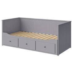 a gray bed with two drawers underneath it