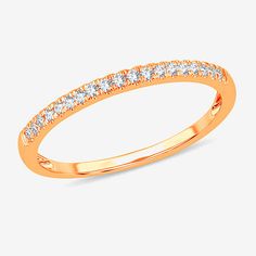 a gold wedding band with rows of diamonds