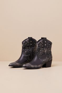 The Dirty Laundry Nowhere Black Distressed Studded Western Ankle Boots will have you channeling your cool inner cowgirl! Distressed faux leather (with a white-washed faded effect) shapes a pointed-toe upper that rises to a seamed vamp and an ankle-high shaft with Western-inspired embroidery and gunmetal studs throughout. The slip-on design features a classic, curved topline with pull tabs at both sides, all atop a stacked block heel. Please note: These boots are intentionally designed to include pre-worn distressing for a trendy lived-in look.   2. 25" stacked block heel. Lightly cushioned insole. Rubber sole has nonskid markings. Man Made Materials. Imported. Lulus | Nowhere Black Distressed Studded Western Ankle High Heel Boots | Size 6. Western Ankle-high Moto Boots For Spring, Western Style Moto Ankle Boots For Spring, Spring Western Ankle Moto Boots, Western Ankle-high Boots For Summer, Leather Boots For Ranch In Summer, Leather Boots For Summer Ranch Activities, Western Style Moto Boots For Spring Events, Western-style Moto Boots For Spring, Leather Boots For Western-themed Summer Events