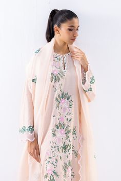 This timeless long shirt silhouette is cut from khaddi silk and is rendered with our signature floral embroidery. An organza dupatta with worked borders and rawsilk trousers complement the look. Spring Straight Kurta With Sheer Dupatta, Spring Kurta With Sheer Dupatta In Chanderi, Spring Chanderi Kurta With Sheer Dupatta, Eid Floral Embroidery Organza Palazzo Set, Eid Floral Embroidered Organza Palazzo Set, Spring Cotton Silk Unstitched Suit With Resham Embroidery, Spring Silk Unstitched Suit With Resham Embroidery, Designer Spring Kurta With Sheer Dupatta, Spring Cotton Silk Dupatta With Resham Embroidery