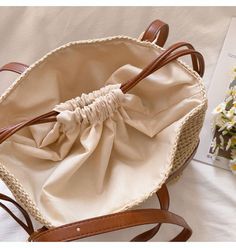 Beige Straw Shoulder Bag With Adjustable Strap, Beige Double Handle Beach Bag With Adjustable Strap, Casual Beach Satchel With Braided Handles, Spring Satchel Straw Bag With Adjustable Strap, Large Capacity Straw Shoulder Bag In Beige, Spring Straw Satchel Shoulder Bag, Beige Straw Satchel Bag, Straw Satchel Shoulder Bag For Spring, Beige Large Capacity Straw Shoulder Bag