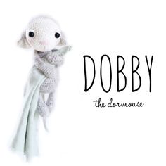 a white stuffed animal with the words dobby on it