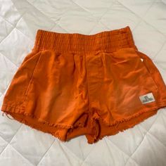 Perfect For Summer Brand New Cheap Urban Outfitters Bottoms For Beach, Summer Bottoms With Elastic Waistband For Weekend, High Rise Cotton Bottoms For Beach Season, Orange Bottoms With Pockets For Beach Season, Orange Cotton Bottoms For Vacation, Casual High Rise Bottoms For Beach Season, Casual Orange Bottoms For Beach Season, Orange Cotton Bottoms For The Beach, Orange Shorts