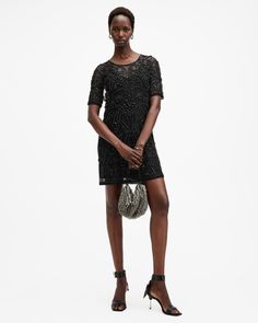 Let's take a moment for the Hania Dress. Beautiful embellishments sit on a mesh base. The easy fitting shape features short sleeves and a crew neck in a mini silhouette. Underneath, a slip lining makes it easy to wear. No matter what dancefloor you're entering, this dress is the ultimate showstopper – let it sparkle.  This dress is designed to a regular fit Back zip closure Crew neck Mini length Short sleeves Mesh fabric Gem embellishments Inner jersey slip dress Short Slip Dress, Embellished Mini Dress, Party Inspo, Mini Dress Black, Wedding Rehearsal, Going Out Outfits, Embellished Dress, Leather Dress, Mesh Dress