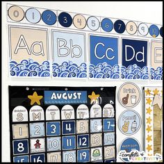 a blue and white calendar with numbers, stars, and other things on the wall