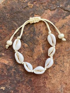 Natural Puka Shell Anklet & Bracelet This is a beautiful and genuine puka shell anklet or bracelet. Hand-crafted with natural shells, this necklace will bring delight to wear in any occasion. The shape and design makes it easy to match any attire that you own. Make it a complete set when you purchase different designs to go along with it.  Please note that because the shells are natural, size and color shade may vary slightly by piece. Puka Shell Anklet, Puca Shell Bracelet, Puka Shell Jewelry, Puka Necklace, Puka Shell Bracelet, Summer Accessories Jewelry, Hawaiian Bracelets, Hand Jewelry Rings, Puka Shell Necklace