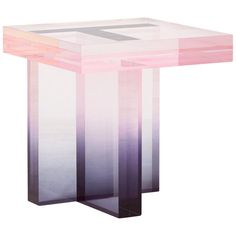 a pink and purple side table with an abstract design on the top, in front of a white background