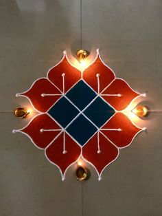 a red and blue tile with lights on it