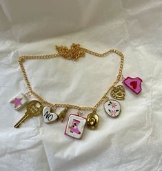 Handmade charm necklace - hand painted and assembled - gold charms - cute pink cowgirl Playful Gold Charms For Gifts, Playful Gold Charm Necklace, Playful Gold Necklaces With Charms, Playful Pink Charm Necklaces, Pink Charm Necklace For Gifts, Pink Personalized Dangle Necklaces, Cute Gold Charm Necklace With Dangling Charms, Personalized Pink Necklace, Pink Enamel Charm Necklace