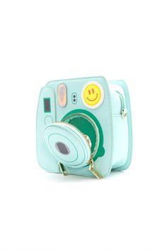 Instagram photo shoot friendly and super cute, this polaroid camera handbag is sure to make a colorful addition to your wardrobe! The outside lens is also a small zipper pockets for coins and other small items. Dimensions: 7.25” x 3” x 7.25”Available in 3 colors - Minty Blue, Pretty Pink, Mellow Yellow Camera Purse, Photo Polaroid, Frog Gifts, Oh Snap, Polaroid Camera, Green Toys, Manhattan Toy, Novelty Bags, Instant Camera