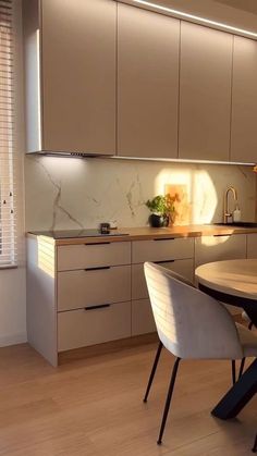 the kitchen is clean and ready to be used for dinner or dinner party, as well as dining room furniture