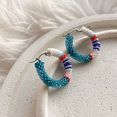 💖 Add a pop of whimsical charm to your outfit with these colorful turquoise seed bead hoop earrings! These abstract beaded hoop earrings are perfect for adding a touch of fun to any look, whether you're dressing up for Halloween or looking for a unique Christmas gift for mom. Stand out from the crowd and show off your unique style with these eye-catching earrings! These handmade hoop earrings are not only stylish but also comfortable to wear all day long * MATERIALS * Hoops are made of high qua Trendy Small Hoop Beaded Earrings, Trendy Round Beaded Earrings, Summer Hoop Earrings With Tiny Beads, Nickel Free Small Hoop Beaded Earrings In Trendy Style, Trendy Turquoise Beaded Earrings, Handmade Hoop Beaded Earrings For Beach, Handmade Beaded Hoop Earrings For Beach, Handmade Turquoise Hoop Earrings For Beach, Trendy Round Beaded Earrings With Ear Wire