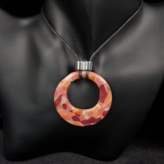 "From day-to-day, to special occasions, this intriguing piece will complement any style.  Hand crafted in polymer clay, and finished with crystal clear domed resin, and a silvered acrylic bead, this pendant is light and easy to wear. This piece is part of a small-batch unrepeatable colourway, and would make a great gift for a loved one, or for yourself (you deserve nice things too, you know!) This piece comes mounted on black cotton 1.5mm cord, adjustable from approx 76cm (30ins) to 40cm 15.75ins).  However, you can request any length of cord - just leave a message in the \"note to seller\" section at checkout.  If you would prefer the pendant mounted on a cord with adjustable lobster clasp, please add the item \"waxed cotton cord necklace\" to your basket, and please remember to state wha Cotton Cord Necklace, Red Coral Necklace, Coral Pendant, Circle Necklace, Nice Things, Cord Necklace, Cotton Cord, Waxed Cotton, Acrylic Beads