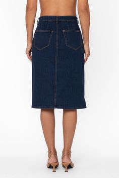 Expertly crafted and versatile, the Moira Skirt is a must-have for any wardrobe. This button-up denim skirt features side and back pockets, as well as belt loops for added convenience. Perfect for any occasion, this utility skirt effortlessly combines style and functionality. Material: 98% Cotton and 2% Elastane Machine wash cold Color: 177 Deep Indigo Model is 5'9"and wearing a size S Imported Dark Wash Midi Skirt With Pockets, High Waist Dark Wash Skirt With Belt Loops, Mid-rise Skirt With Belt Loops In Medium Wash, Knee-length Lined Denim Skirt, Lined Knee-length Denim Skirt, Medium Wash Midi Skirt With Pockets, Knee-length Relaxed Denim Skirt With Pockets, Relaxed Knee-length Denim Skirt With Pockets, Denim Blue Pencil Skirt With Pockets