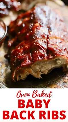 baby back ribs covered in bbq sauce on a cutting board with text overlay