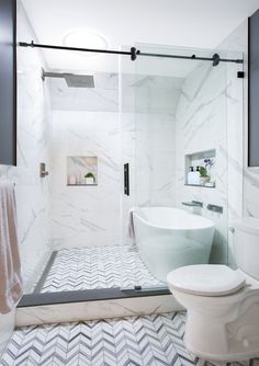 A second-floor hall bath has a wet room with a soaking tub on one side and shower on the other. It is separated from the toilet and vanity by a glass frameless shower door. A newly installed sky tunnel window brings tons of light into a previously windowless space. The toilet was moved and shelving now frames the vanity, not visible in the photo, to the right of the toilet. Shower Tub Toilet Room, Bathroom Jacuzzi Tub Ideas Glass Showers, Shower With A Tub In It, Bath Shower Side By Side, Soaking Tub In Shower Walk In, Super Shower Bathroom, Tube Inside Shower Ideas, Small Bathroom With Separate Shower And Bathtub, Shower And Bath Side By Side