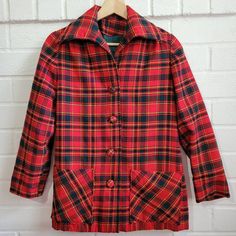 "This jacket is in excellent vintage condition.  The color is vibrant and the cut is super 70s. Look at the big collar, the slightly puckered shoulder, and the flat rectangular front-pockets. It has a nice structure to it, and the wool is sturdy.  70s women's chore jacket.  This piece is a stunner.  Great for fall through winter.  Pictures show two very tiny pin holes which are not noticeable when wearing.  Women's size small 18.25\" armpit to armpit; 21.5\" sleeve; 25.25\" down the back" 70s Look, 70s Women, Big Collar, Pin Hole, Chore Jacket, Red Tartan, Winter Pictures, 70s Vintage, Red Jacket