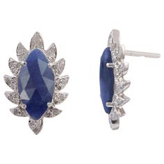 Bold and modern, these marquise stud diamond earrings exude a captivating sophistication. Cast in 18K gold and sterling silver. It is hand set in 3.30 carat blue sapphire and .30 carats of signature diamond pave arches. FOLLOW MEGHNA JEWELS storefront to view the latest collection & exclusive pieces. Meghna Jewels is proudly rated as a Top Seller on 1stDibs with 5 star customer reviews. All items manufactured by us are handmade and can be customized or redesigned. Luxury Marquise Gemstone Earrings, Marquise Sterling Silver Diamond Earrings, Marquise Diamond Earrings In Sterling Silver, Sterling Silver Marquise Cut Earrings, Sterling Silver Marquise Diamond Earrings With Prong Setting, Blue Marquise Earrings For Anniversary, Luxury Marquise Sterling Silver Earrings, Sterling Silver Earrings With Diamond Accents, Marquise Cut, Blue Sapphire Diamond