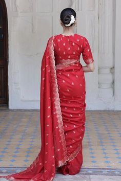 Red saree crafted in moonga silk with gold toned mughal flora vine woven detail along the scallop border and damask butti detail. Paired with a matching half sleeves closed round neck blouse. - Aza Fashions Red Silk Pre-draped Saree For Traditional Ceremonies, Red Cotton Silk Blouse Piece For Traditional Ceremonies, Red Raw Silk Pre-draped Saree For Traditional Ceremonies, Red Banarasi Silk Blouse For Traditional Ceremonies, Red Blouse With Zari Weaving For Traditional Ceremonies, Elegant Red Katan Silk Sets, Red Slub Silk Blouse Piece With Traditional Drape, Red Blouse With Dupatta For Traditional Ceremonies, Red Fitted Raw Silk Pre-draped Saree