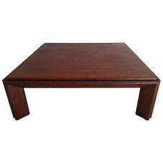 a wooden coffee table with one end missing and the top partially covered in woodgrain