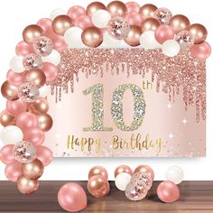 a pink and gold 10th birthday party with balloons