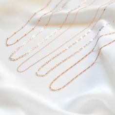 "A light and dainty, single chain necklace made of all 14K rose gold filled materials. Choose the chain style you like and customize the length. For half inch or extra short/long chains, simply leave a note at checkout. 14K Rose Gold-filled, tarnish-resistant, and water-resistant. Lengths 13 inches and under will come with an additional 2 inch extension meaning you can adjust the necklace to be lengths 13 - 15 inches so you can be confident it'll fit your neck perfectly and comfortably. You can Minimalist Rose Gold Chain Link Necklace, Everyday Delicate Rose Gold Chain Necklace, Minimalist Rose Gold Paperclip Chain Jewelry, Rose Gold Minimalist Cable Chain Necklace, Rose Gold Chain Necklace With Delicate Rectangular Links, Minimalist Rose Gold Cable Chain Necklace, Rose Gold Chain Necklace With Adjustable Chain For Everyday, Rose Gold Adjustable Chain Necklace For Everyday, Rose Gold Link Chain Necklace With Paperclip Chain