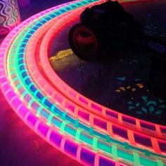 neon colored lights are glowing on the floor